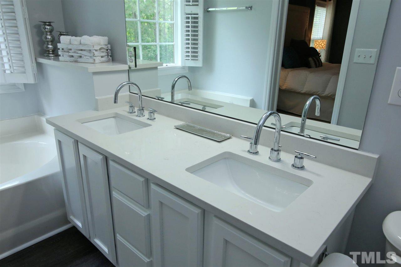 2525 Springfield Park Drive Raleigh, NC 27614 - Photo 15 of 25 Updated master bath with dual sinks and quartz countertops. Garden tub with large picture window and separate shower.
