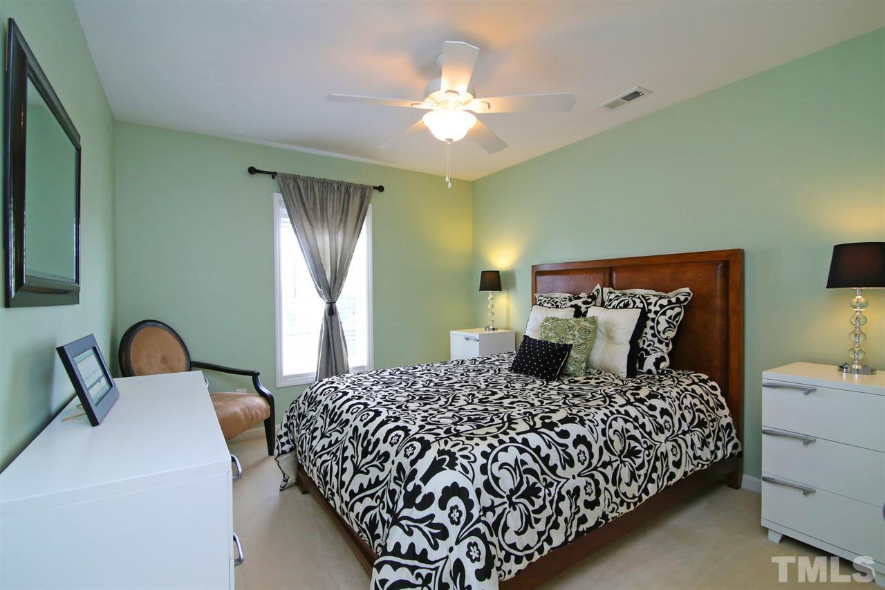2525 Springfield Park Drive Raleigh, NC 27614 - Photo 17 of 25 One of three additional bedrooms upstairs. All bedrooms include a ceiling fan.