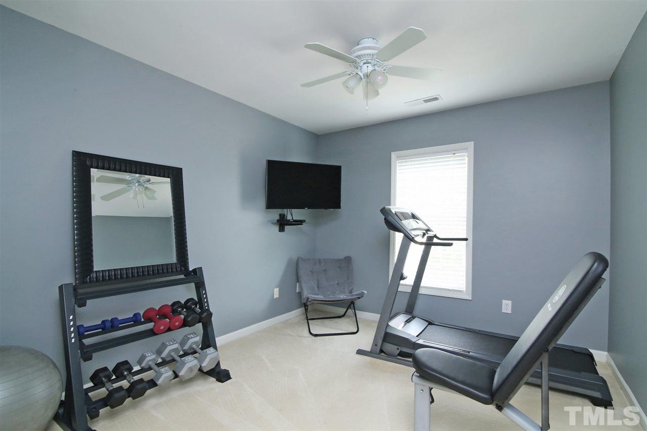 2525 Springfield Park Drive Raleigh, NC 27614 - Photo 18 of 25 One of three additional bedrooms upstairs. All bedrooms include a ceiling fan.
