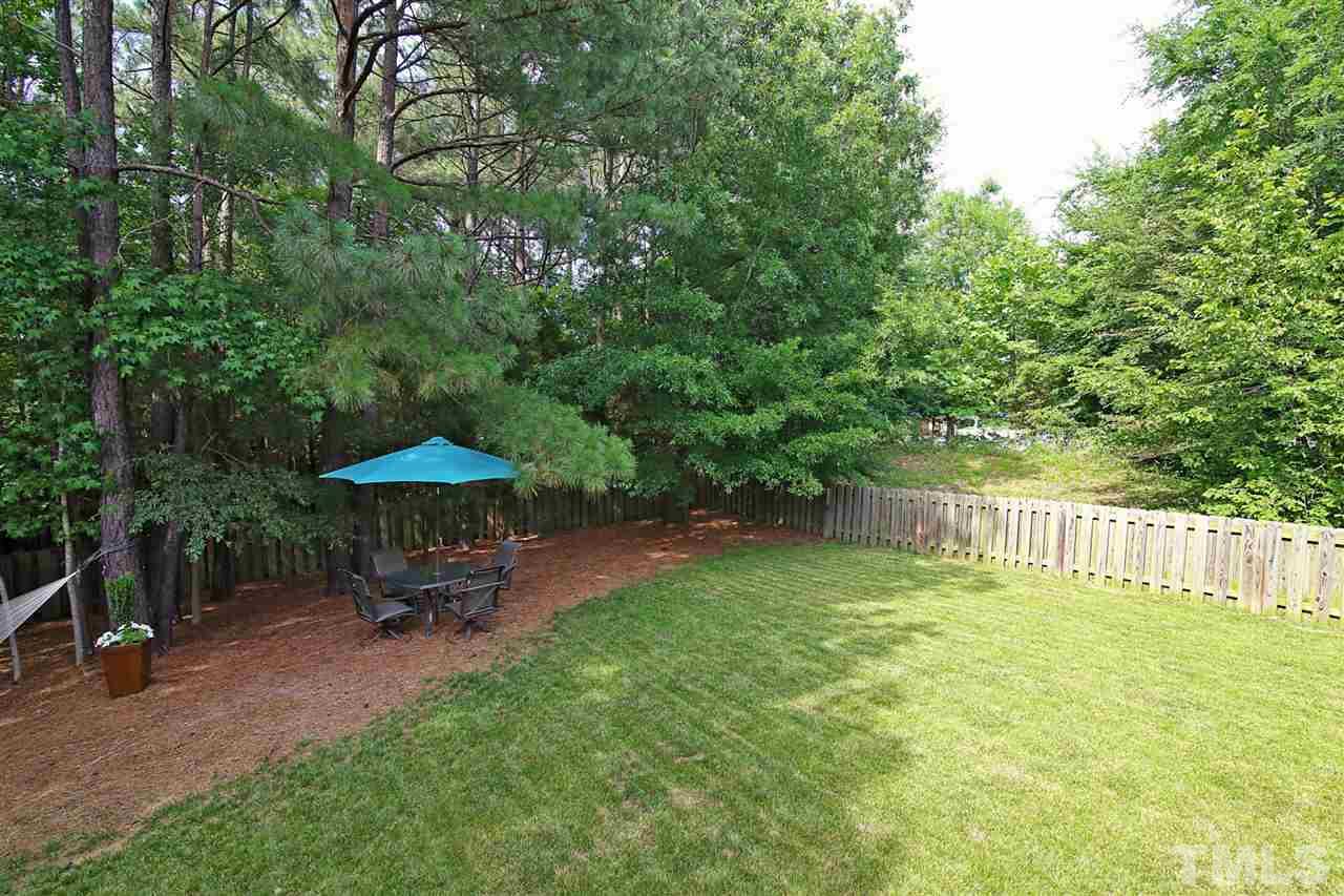 2525 Springfield Park Drive Raleigh, NC 27614 - Photo 22 of 25 Tree-lined backyard with plenty of grass. Fully fenced. No neighbors behind you or on one side. Ultimate privacy!