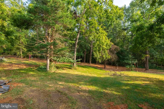 a view of swimming pool with a yard