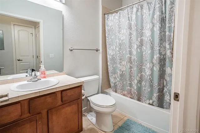 a bedroom with a bed and a table