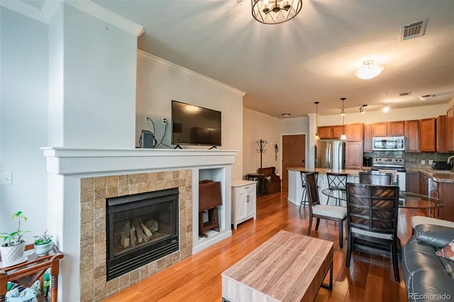 a living room with furniture fireplace and flat screen tv