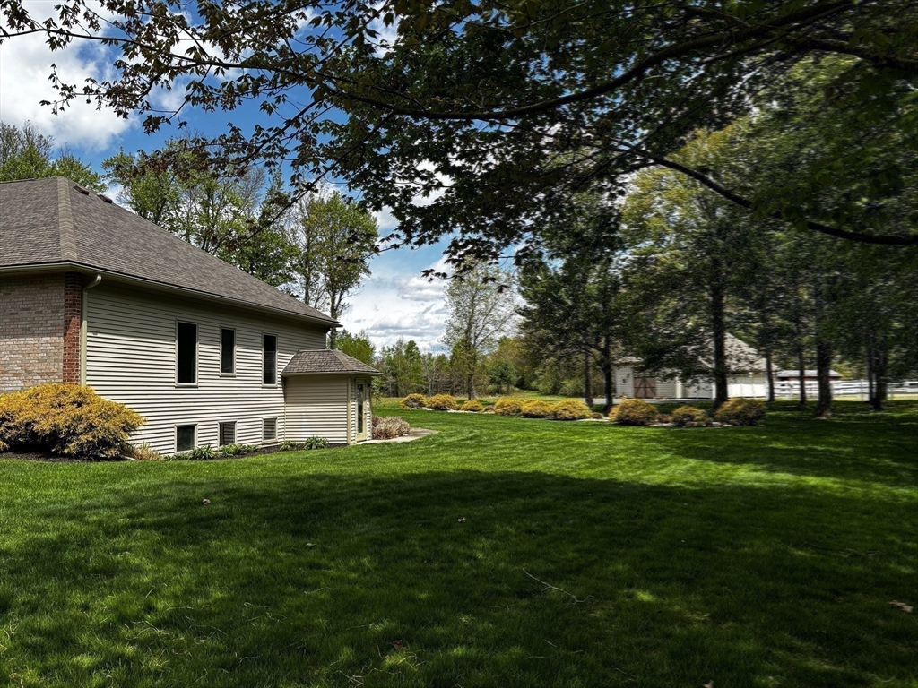 33 Labrie Lane Holyoke, MA 01040 - Photo 31 of 42 a front view of a house with a garden