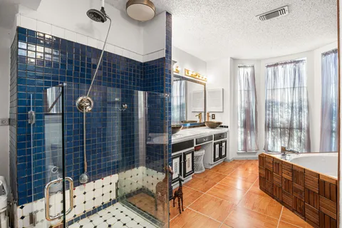 a large kitchen with granite countertop a sink and a stove