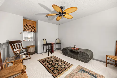 a large kitchen with a table and chairs