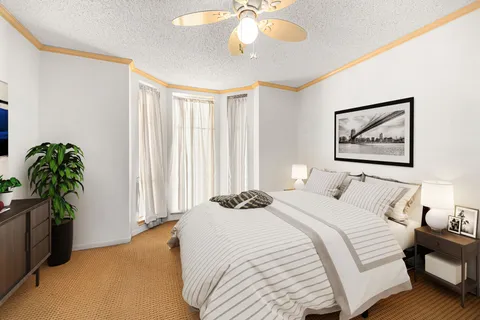 a bedroom with a bed and a window