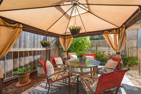 a bathroom with a sink a mirror and painting on the wall