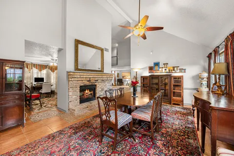 a living room with furniture fireplace and flat screen tv