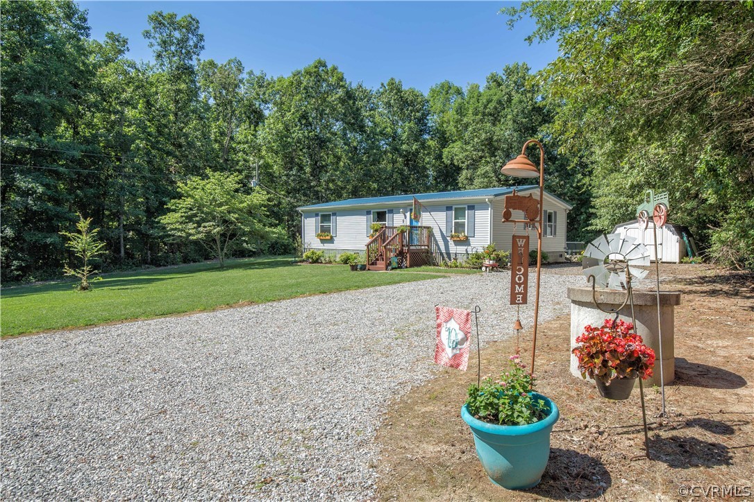6905 Trinity Church Road Church Road, VA 23833 - Photo 3 of 35 a house with lots of trees in the background