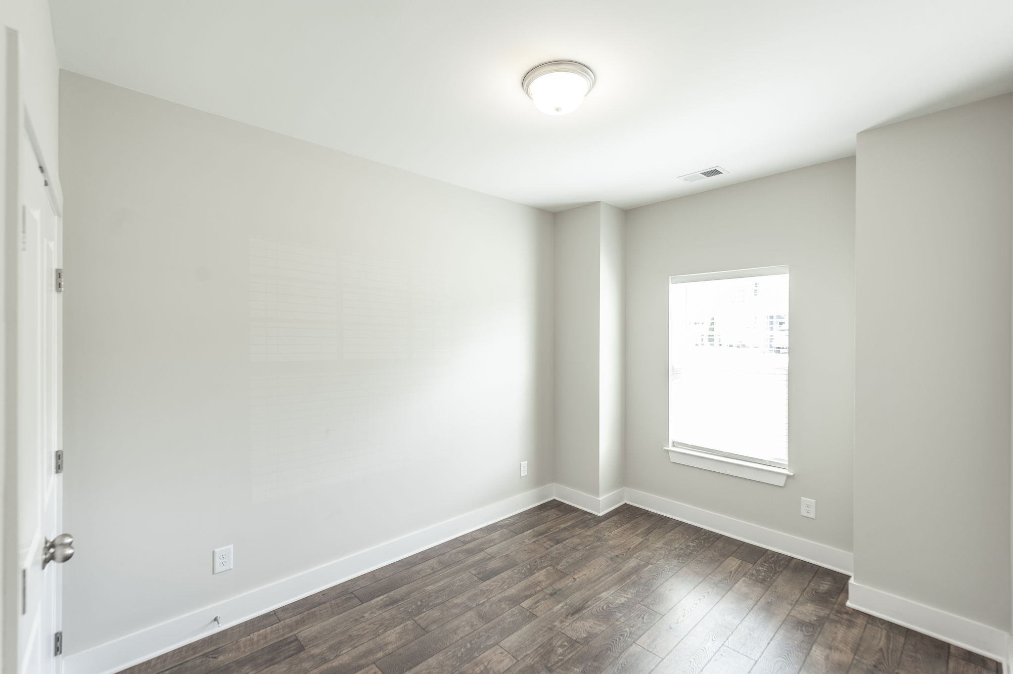 1144 Lock 4 Road, Unit A2 Gallatin, TN 37066 - Photo 11 of 66 an empty room with wooden floor and windows