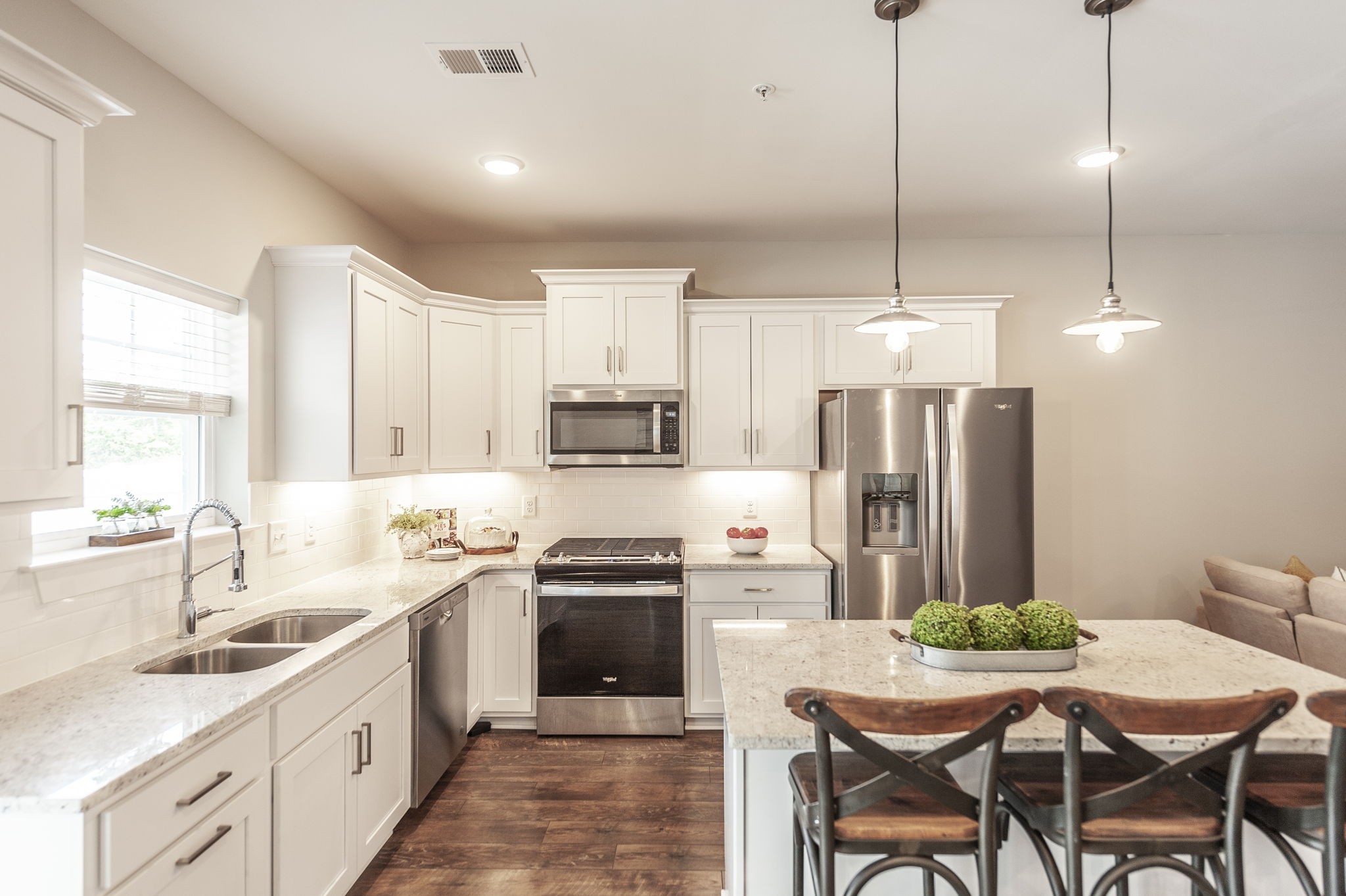1144 Lock 4 Road, Unit A2 Gallatin, TN 37066 - Photo 23 of 66 a kitchen with stainless steel appliances kitchen island granite countertop a sink a stove a refrigerator and island with wooden floor
