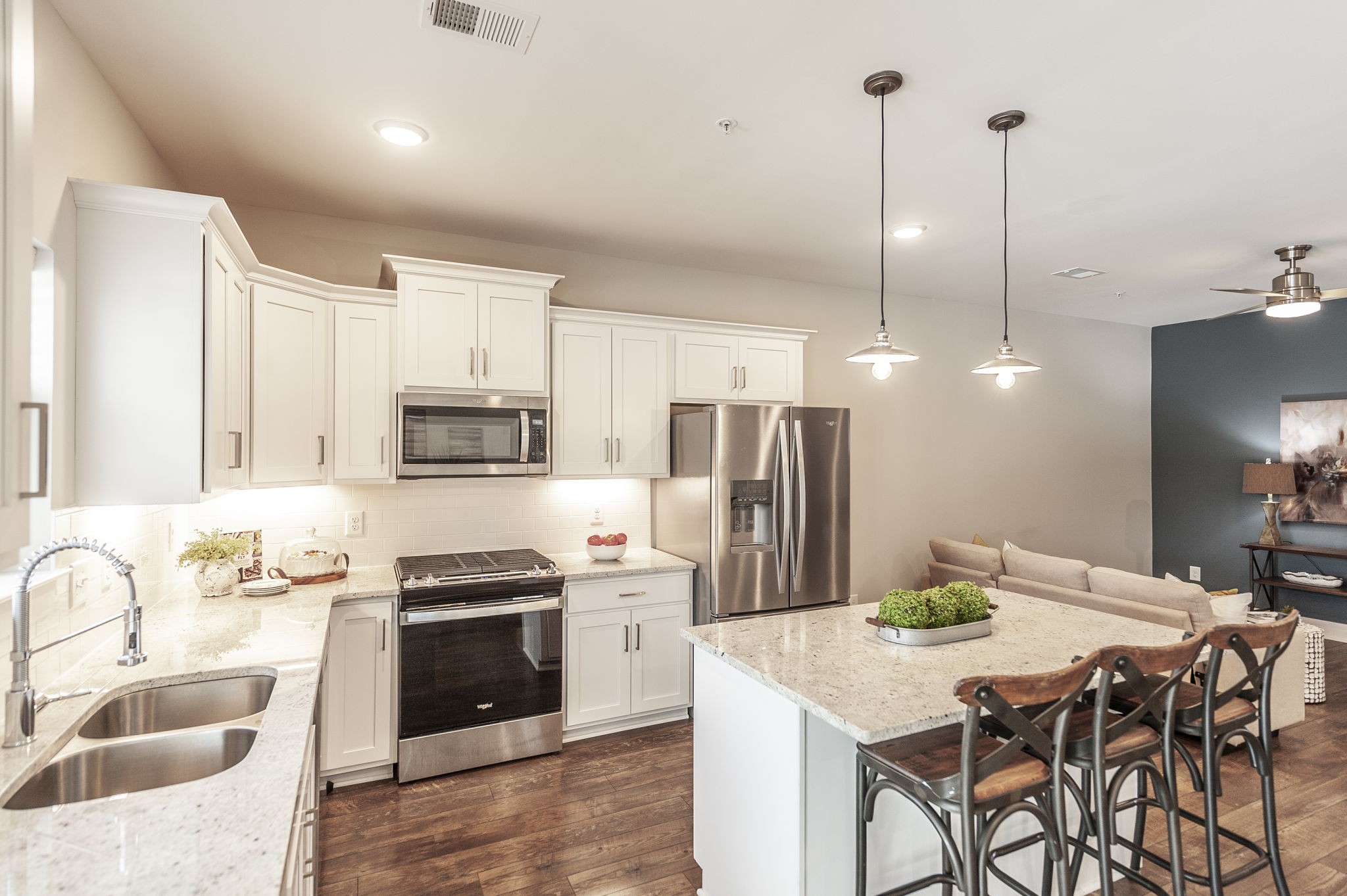 1144 Lock 4 Road, Unit A2 Gallatin, TN 37066 - Photo 24 of 66 a kitchen with stainless steel appliances kitchen island granite countertop a kitchen island hardwood floor sink and stove