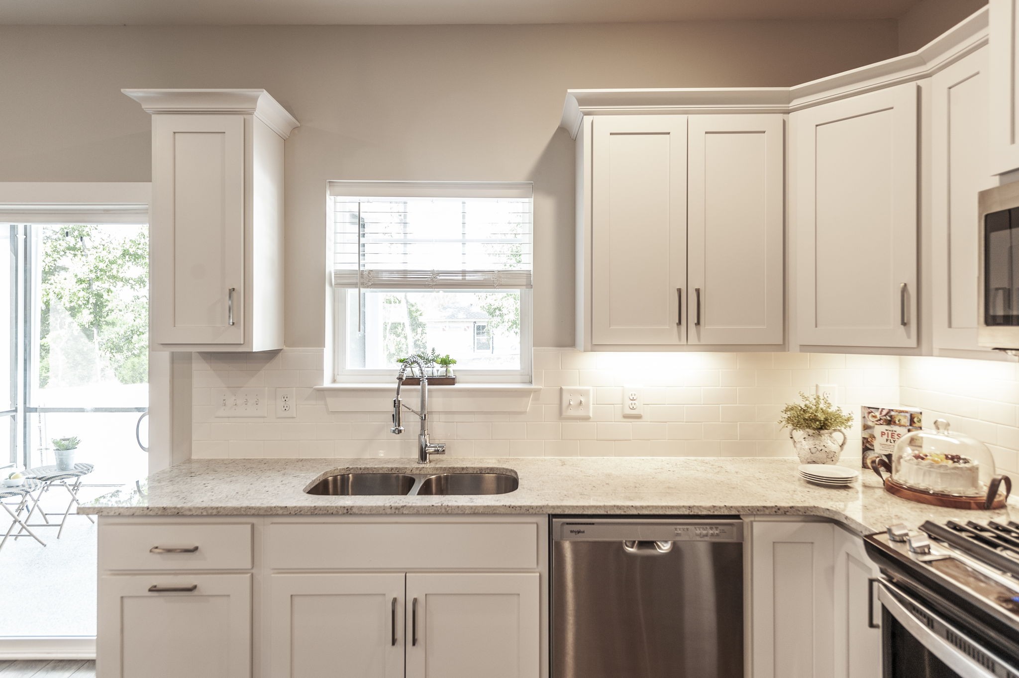 1144 Lock 4 Road, Unit A2 Gallatin, TN 37066 - Photo 25 of 66 a kitchen with granite countertop white cabinets and white appliances