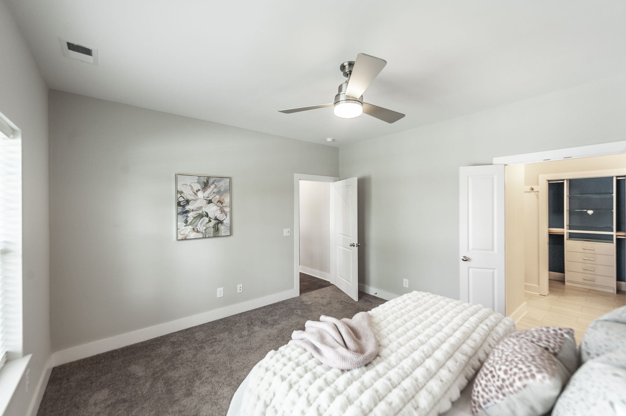 1144 Lock 4 Road, Unit A2 Gallatin, TN 37066 - Photo 35 of 66 a bedroom with a large bed and a chandelier