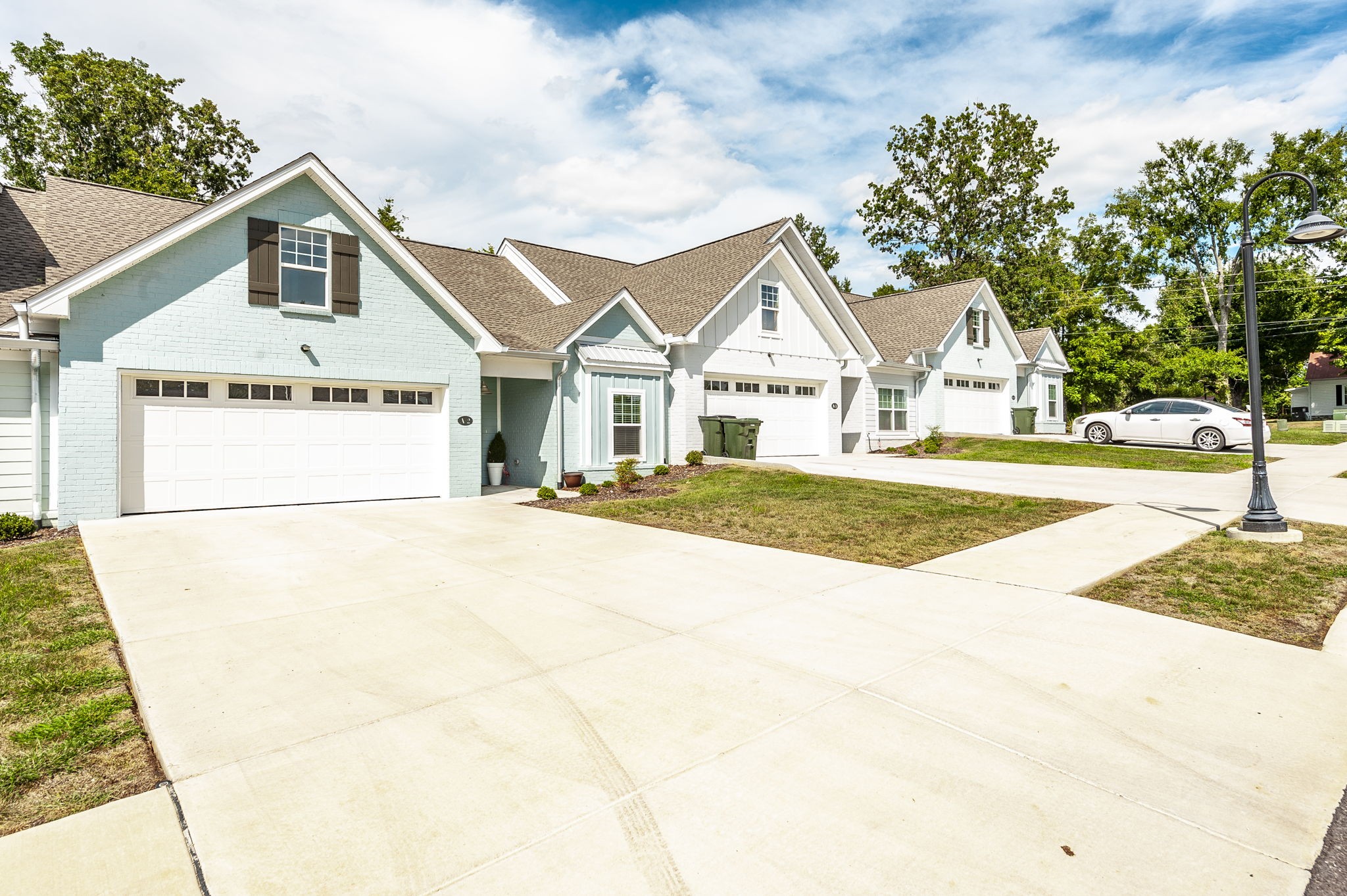 1144 Lock 4 Road, Unit A2 Gallatin, TN 37066 - Photo 5 of 66 a view of a white house with a large tree and wooden fence