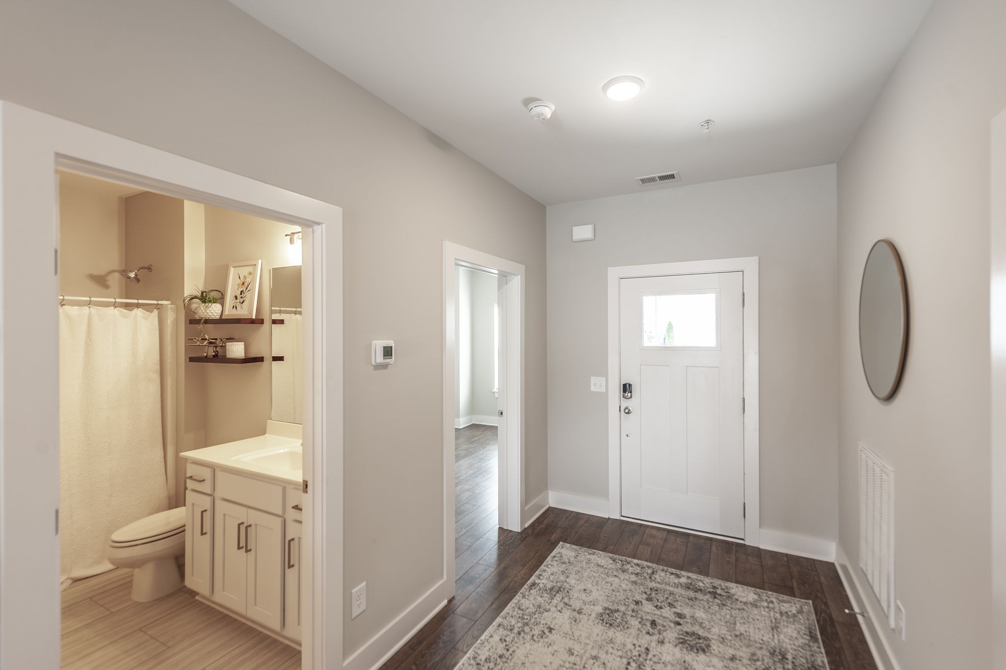 1144 Lock 4 Road, Unit A2 Gallatin, TN 37066 - Photo 10 of 66 a bathroom with a granite countertop sink a toilet and shower