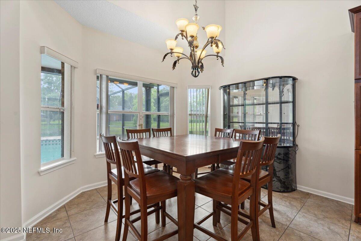 1127 Emilys Walk Lane West Jacksonville, FL 32221 - Photo 19 of 43 a view of a dining room with furniture window and outside view