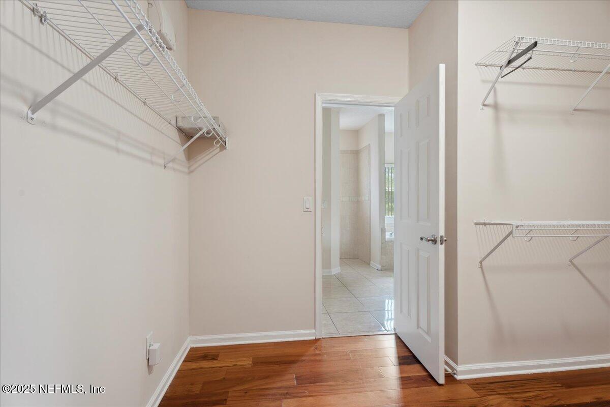 1127 Emilys Walk Lane West Jacksonville, FL 32221 - Photo 27 of 43 a view of walk in closet with wooden floor