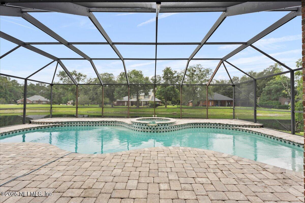 1127 Emilys Walk Lane West Jacksonville, FL 32221 - Photo 30 of 43 a view of a swimming pool with a yard