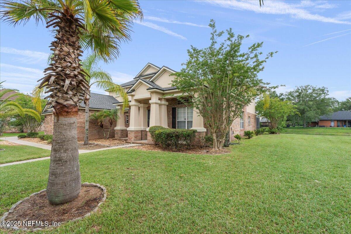 1127 Emilys Walk Lane West Jacksonville, FL 32221 - Photo 3 of 43 a front view of a house with garden