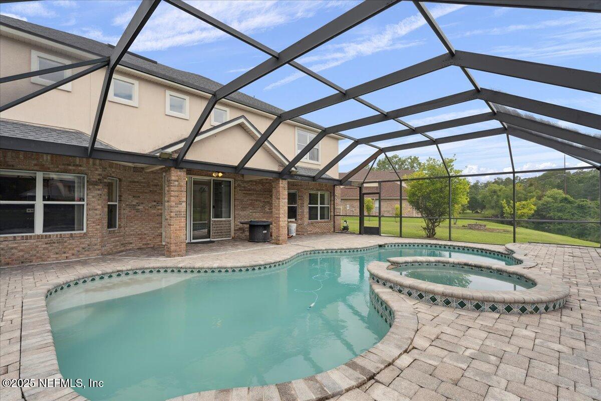 1127 Emilys Walk Lane West Jacksonville, FL 32221 - Photo 32 of 43 a view of a patio with a table and chairs
