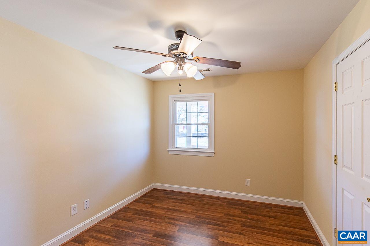 8031 Howardsville Road Howardsville, VA 24562 - Photo 22 of 30 a view of an empty room with window and wooden floor