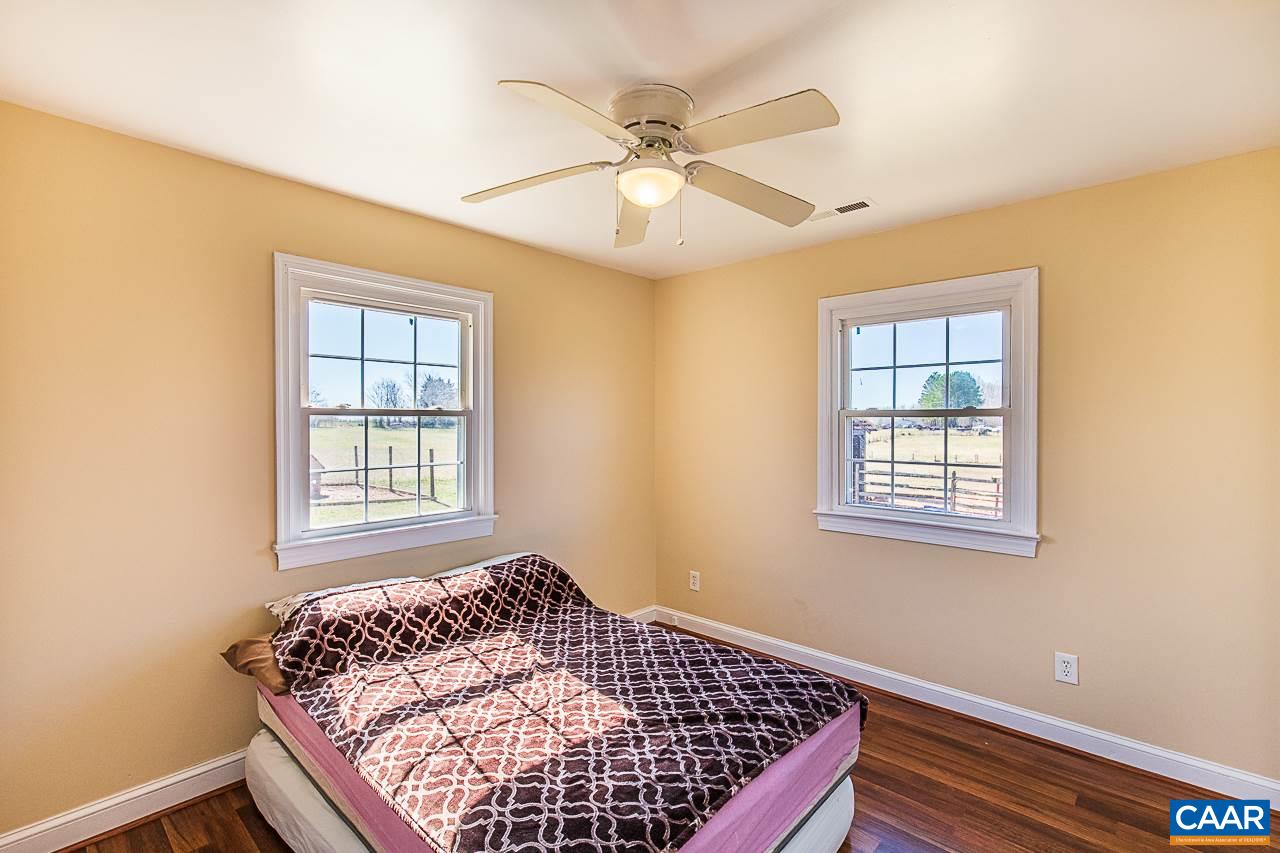 8031 Howardsville Road Howardsville, VA 24562 - Photo 26 of 30 a bedroom with a bed and window
