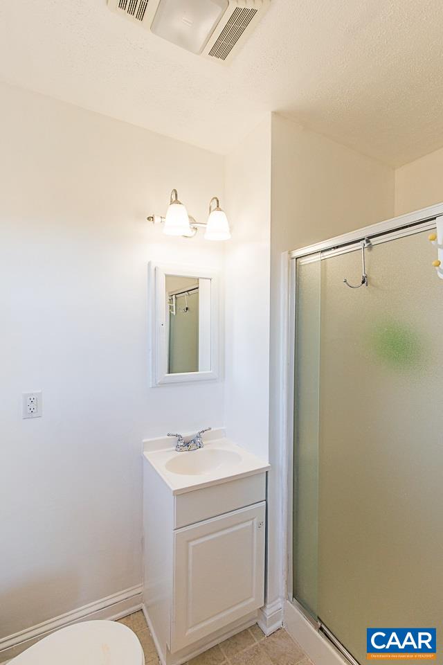 8031 Howardsville Road Howardsville, VA 24562 - Photo 28 of 30 a bathroom with a sink vanity and a mirror