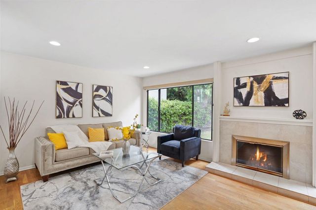 a bed room with a bed and a night stand