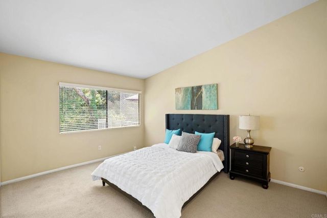 a view of a patio with couches and potted plants