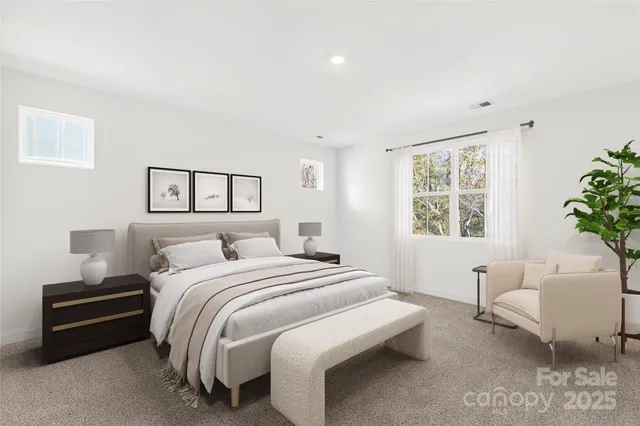 a bedroom with a bed and a couch