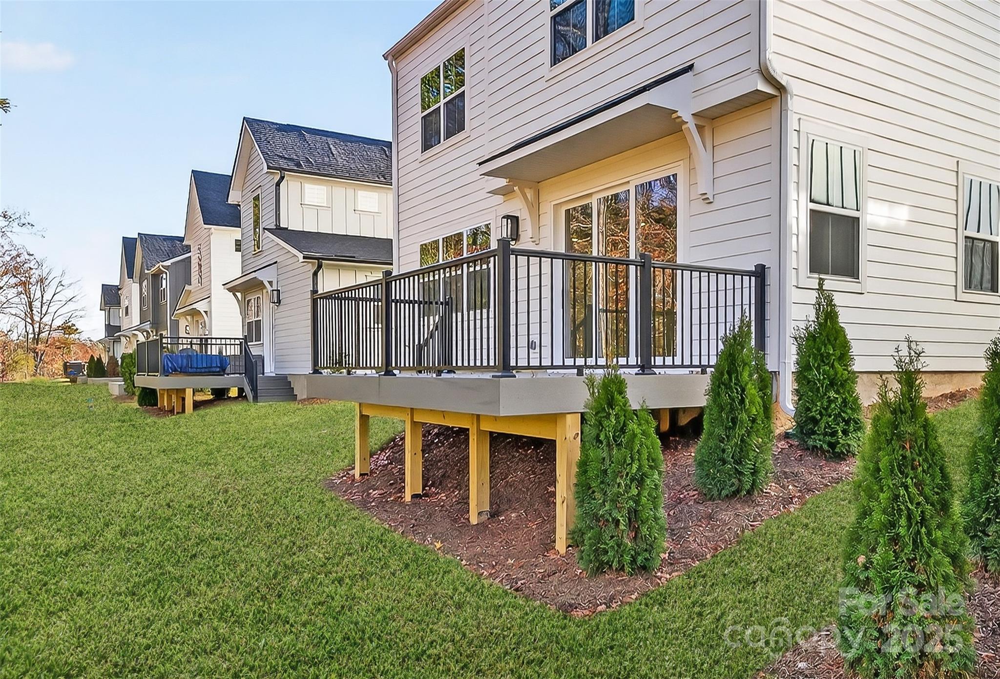 520 Zinc Drive Tega Cay, SC 29708 - Photo 20 of 20 a view of a chair and table in backyard of the house