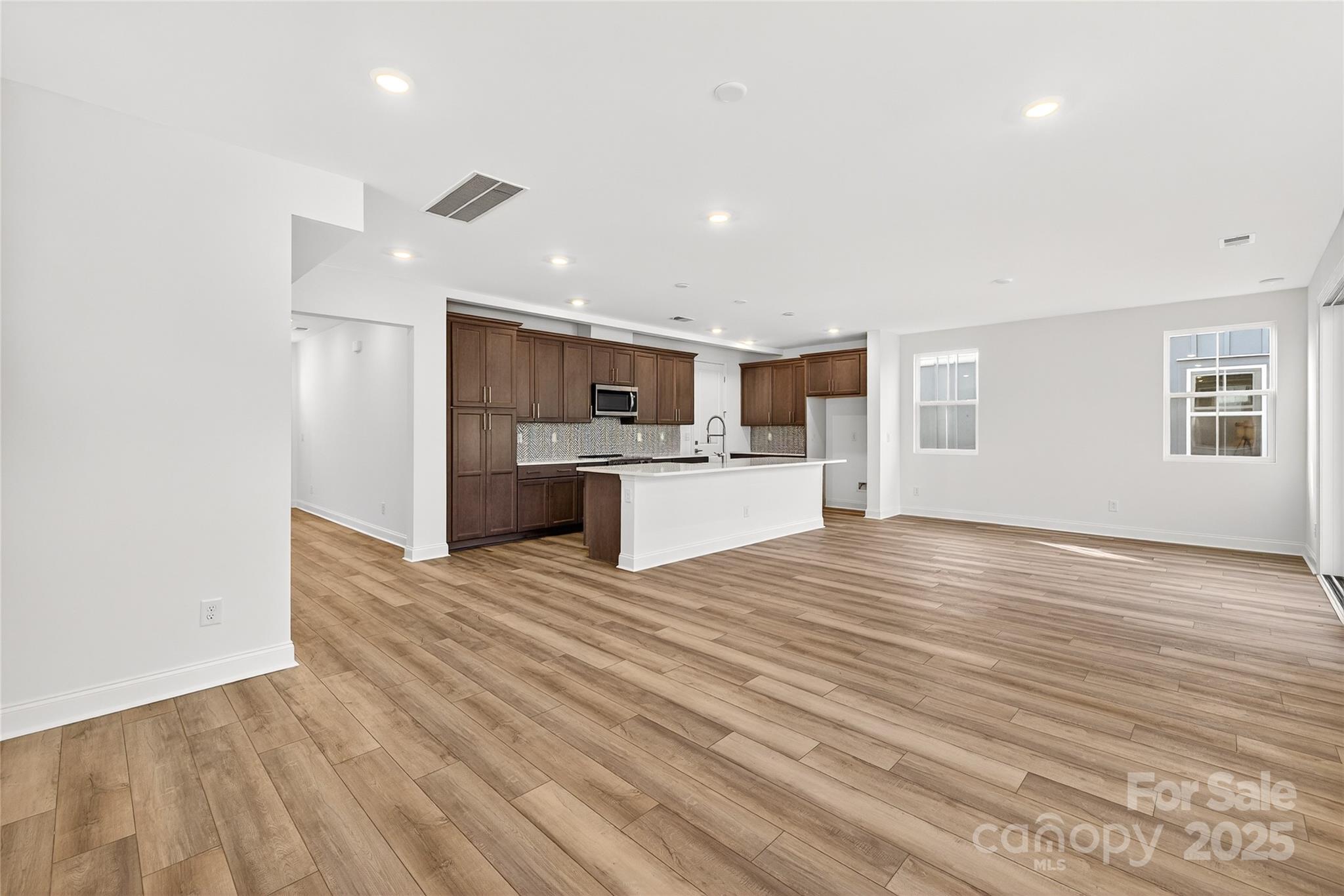 520 Zinc Drive Tega Cay, SC 29708 - Photo 6 of 20 a view of kitchen and wooden floor