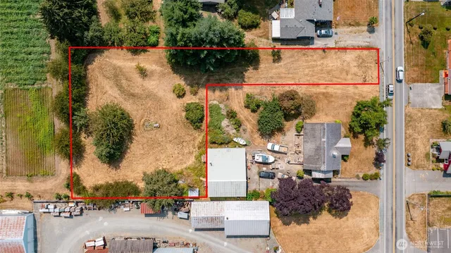 an aerial view of a house with outdoor space
