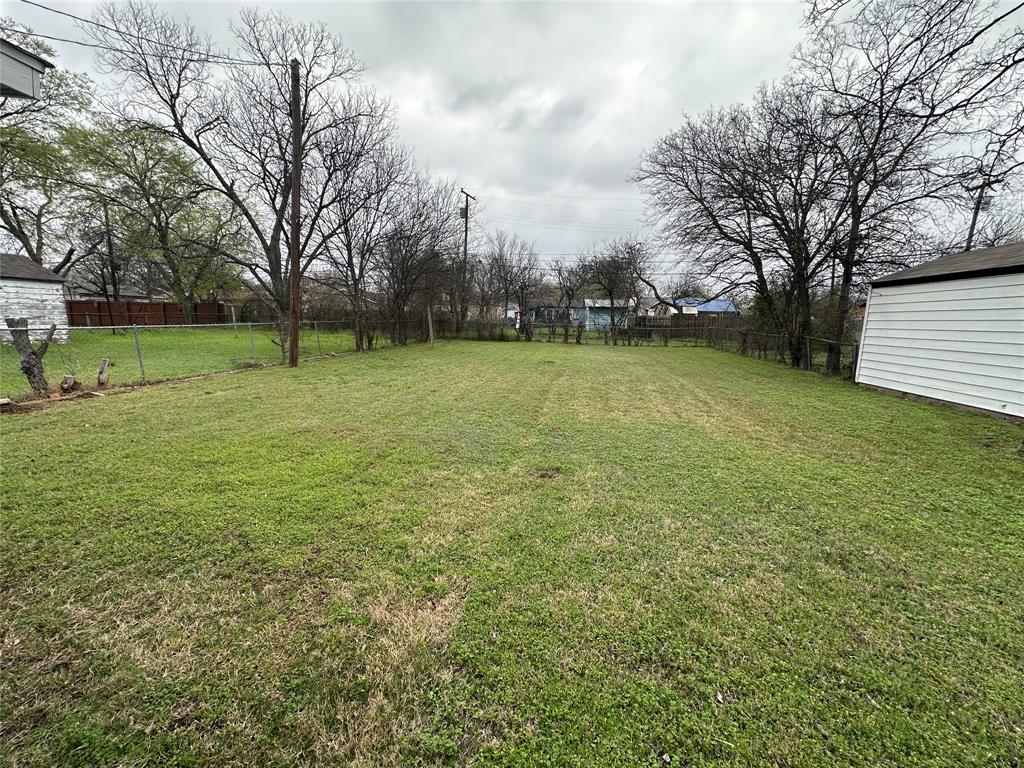 504 Bales Street Cleburne, TX 76033 - Photo 11 of 11 a view of a field with trees