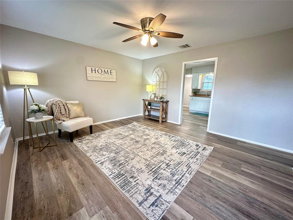 504 Bales Street Cleburne, TX 76033 - Photo 3 of 11 a living room with couch and wooden floor