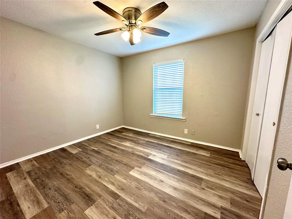 504 Bales Street Cleburne, TX 76033 - Photo 6 of 11 a view of an empty room with a window