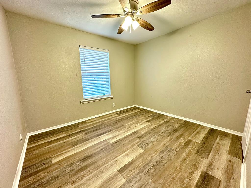 504 Bales Street Cleburne, TX 76033 - Photo 9 of 11 a view of a room with a flat screen tv