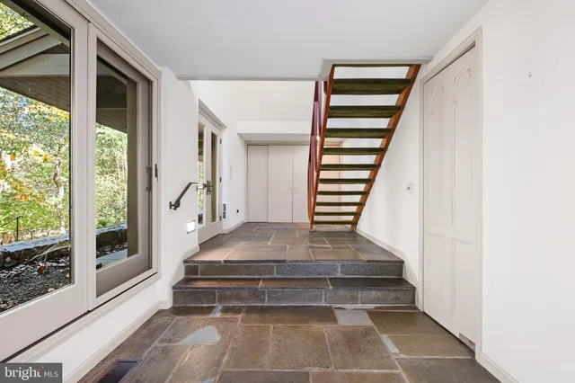 a view of a front door and a yard