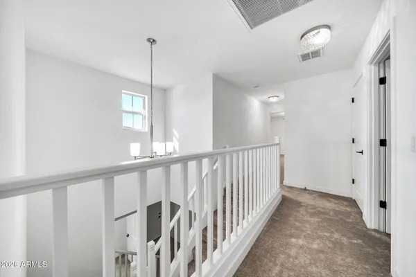 a view of a hallway with windows