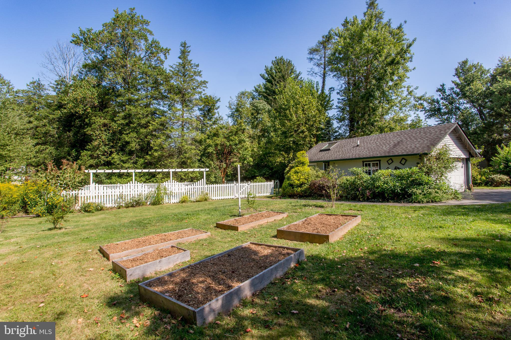 505 East State Street Doylestown, PA 18901 - Photo 5 of 5 a view of a backyard with table and chairs and potted plants
