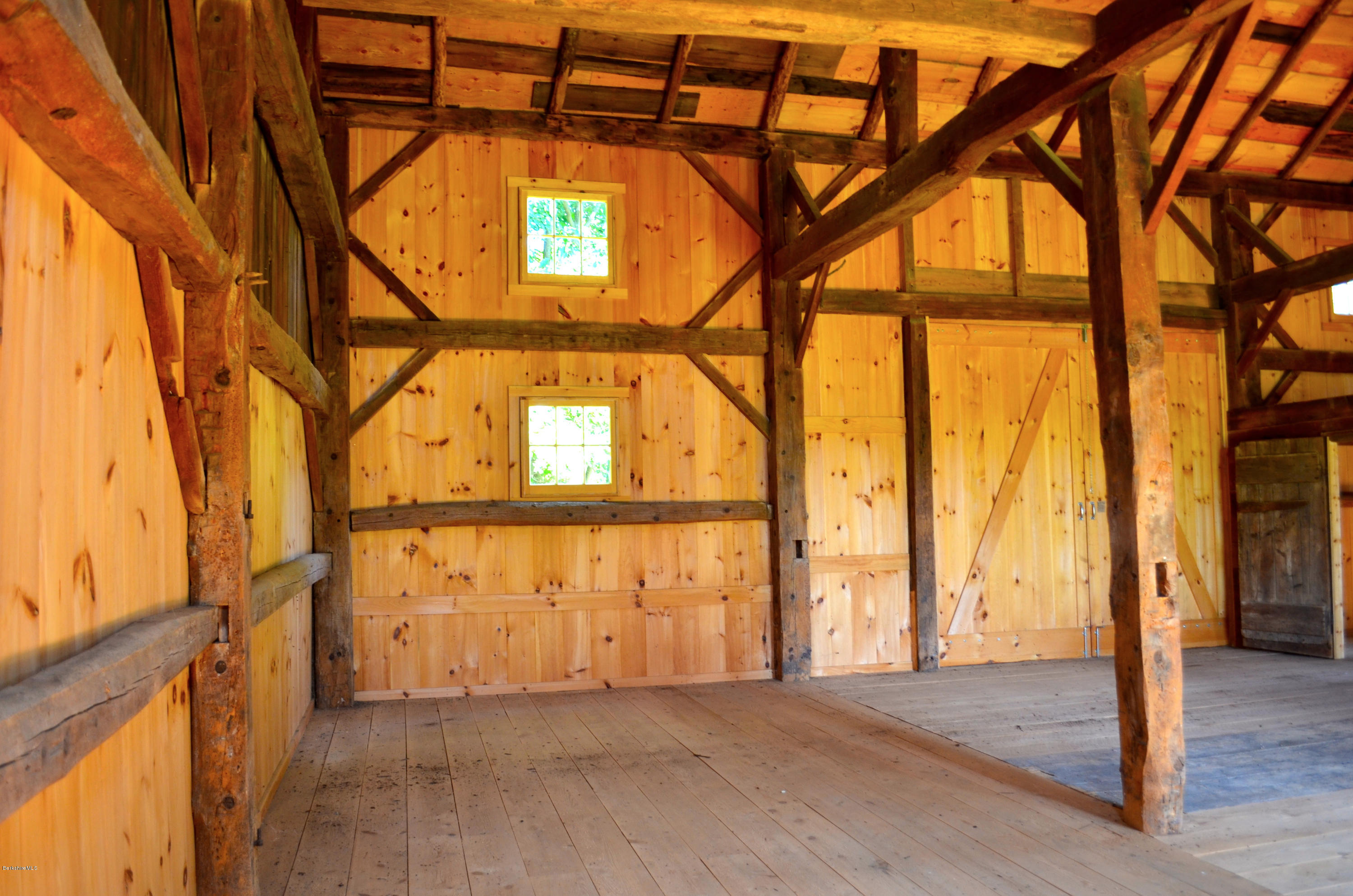 175 Hoyle Road Craryville, NY 12521 - Photo 4 of 9 a view of an empty room with wooden floor and door
