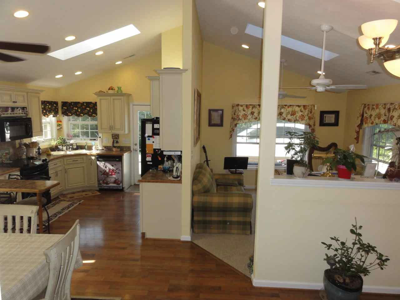 584 Zimmerman Road Blue Ridge, VA 24064 - Photo 4 of 33 a living room with fireplace furniture and a wooden floor
