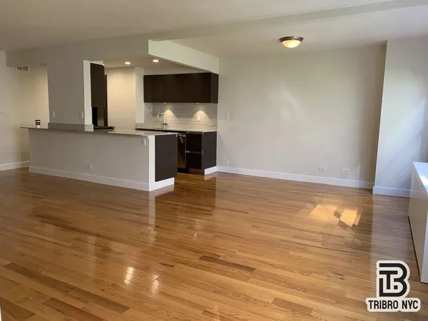 a view of a living room with a flat screen tv