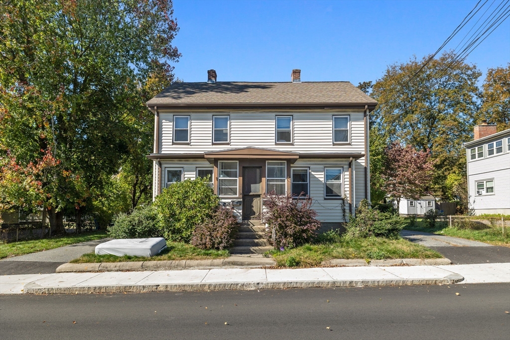 88 Hammond Street Waltham, MA 02451 - Photo 2 of 4 a front view of a house with a yard