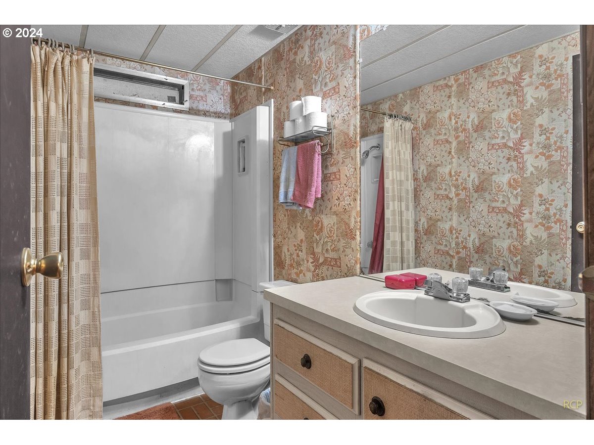 56925 Walker Road Scappoose, OR 97056 - Photo 20 of 40 a bathroom with a sink toilet and shower