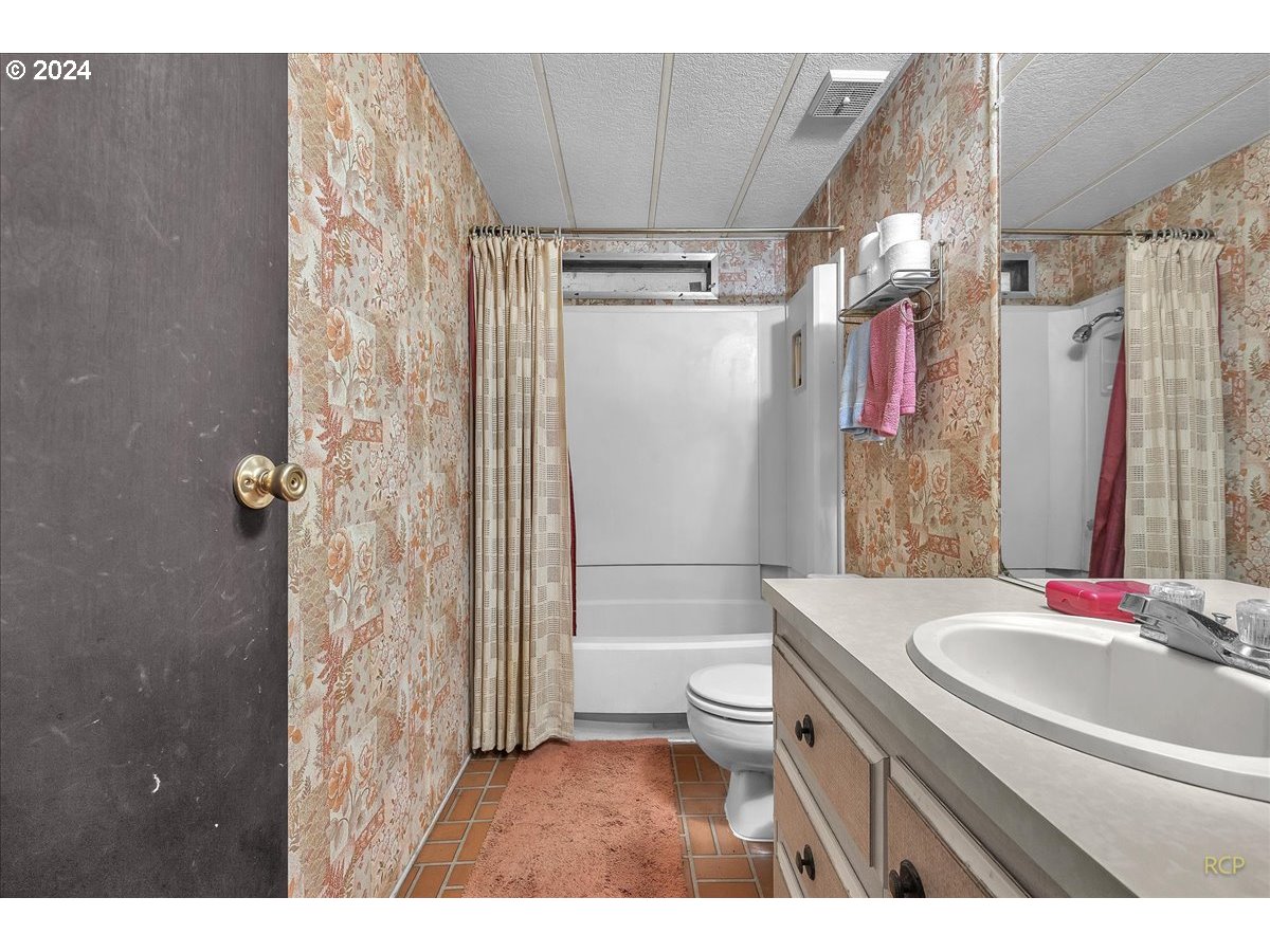 56925 Walker Road Scappoose, OR 97056 - Photo 21 of 40 a bathroom with a sink a toilet and shower