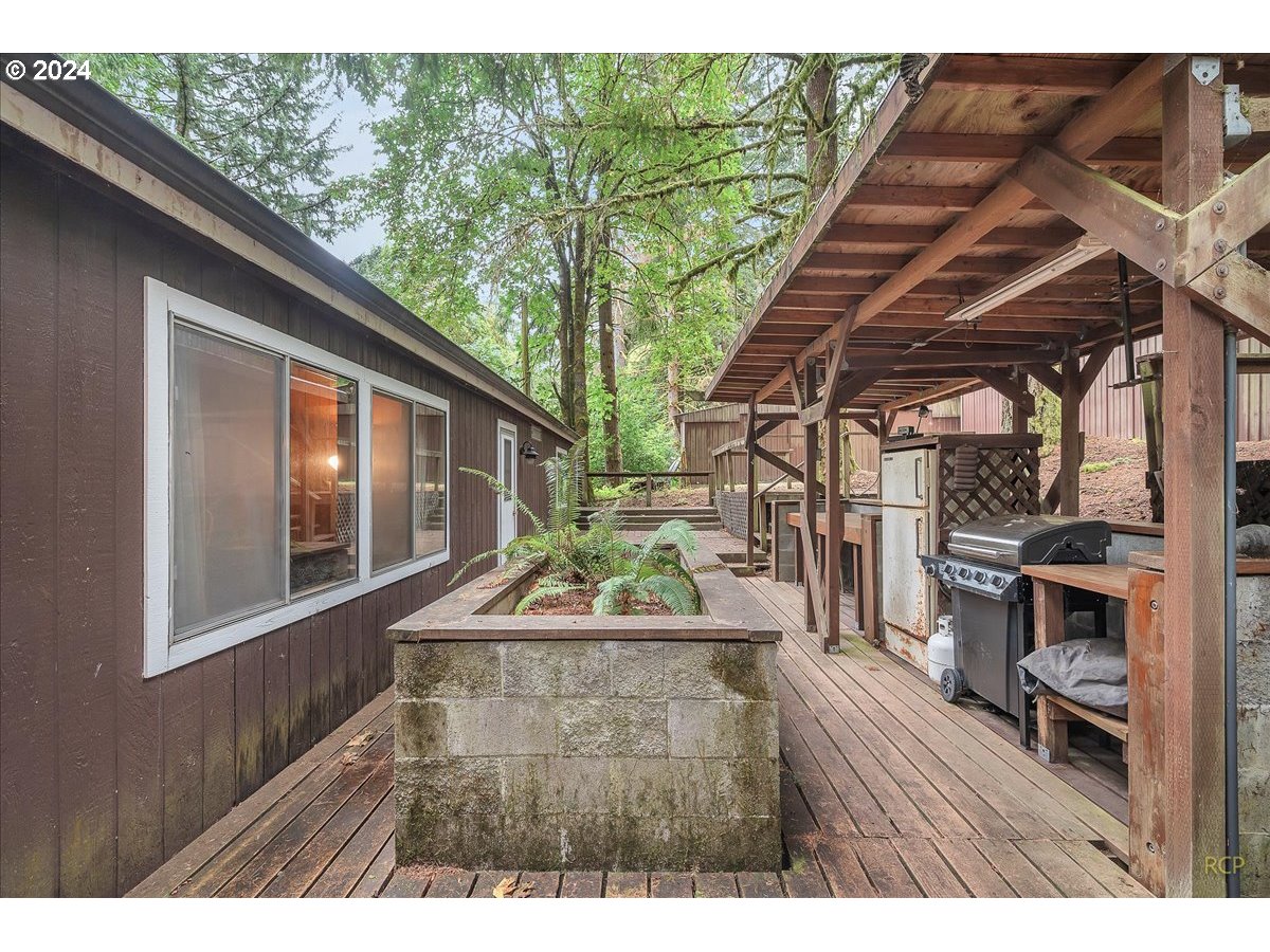 56925 Walker Road Scappoose, OR 97056 - Photo 23 of 40 a backyard of a house with barbeque oven