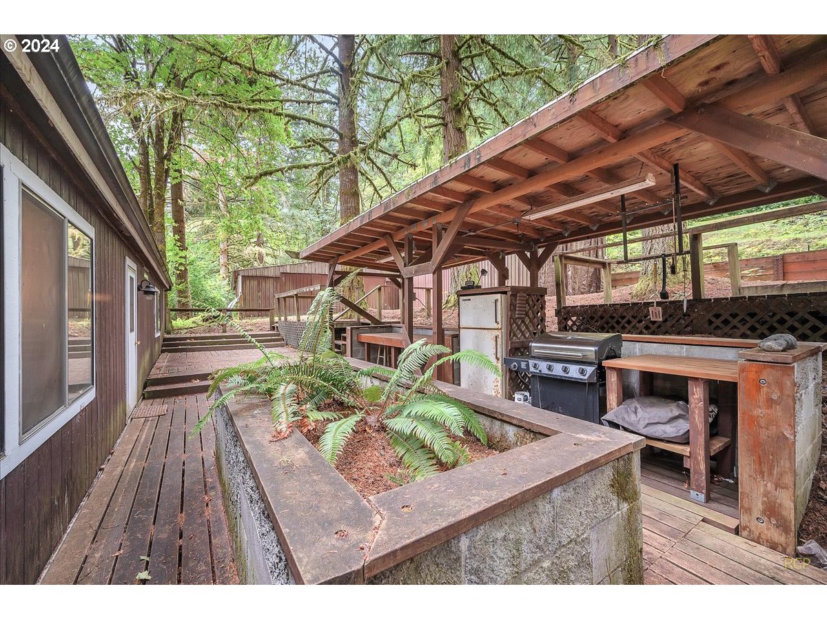 56925 Walker Road Scappoose, OR 97056 - Photo 24 of 40 a backyard of a house with barbeque oven